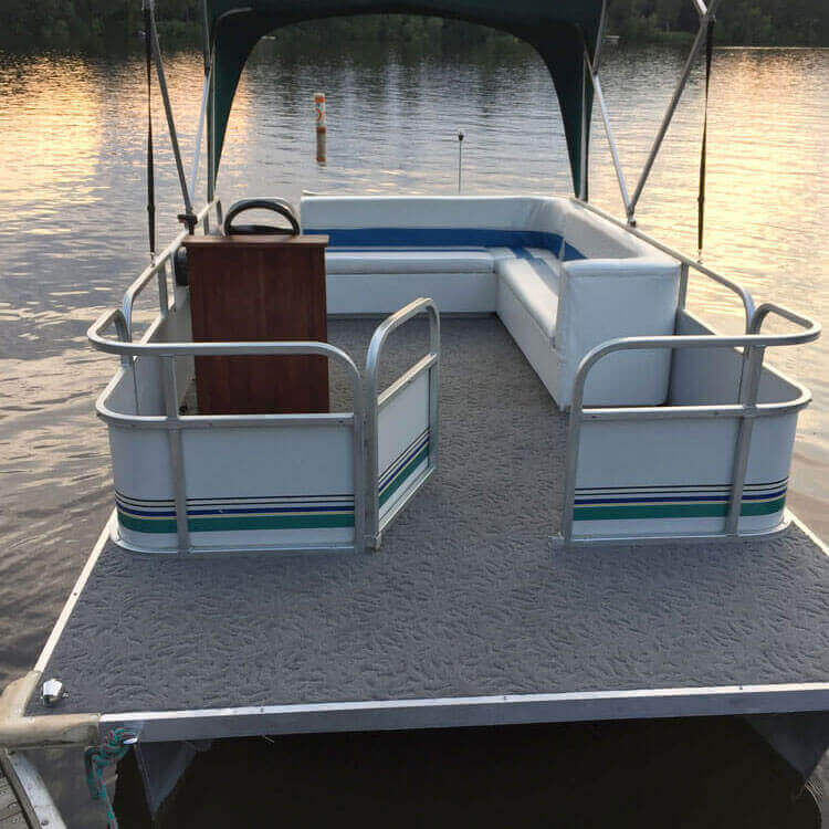 Boat with a teal green canopy